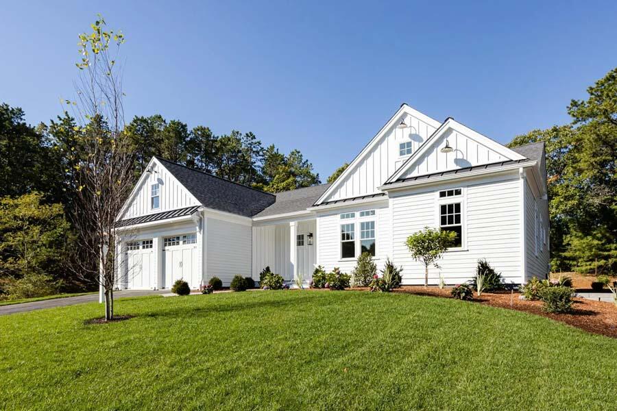 55 Palmer Road Mashpee, MA 02649 - Photo 2 of 42 a front view of a house with garden