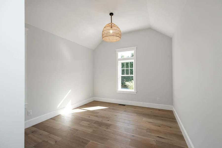 55 Palmer Road Mashpee, MA 02649 - Photo 31 of 42 an empty room with wooden floor fan and windows