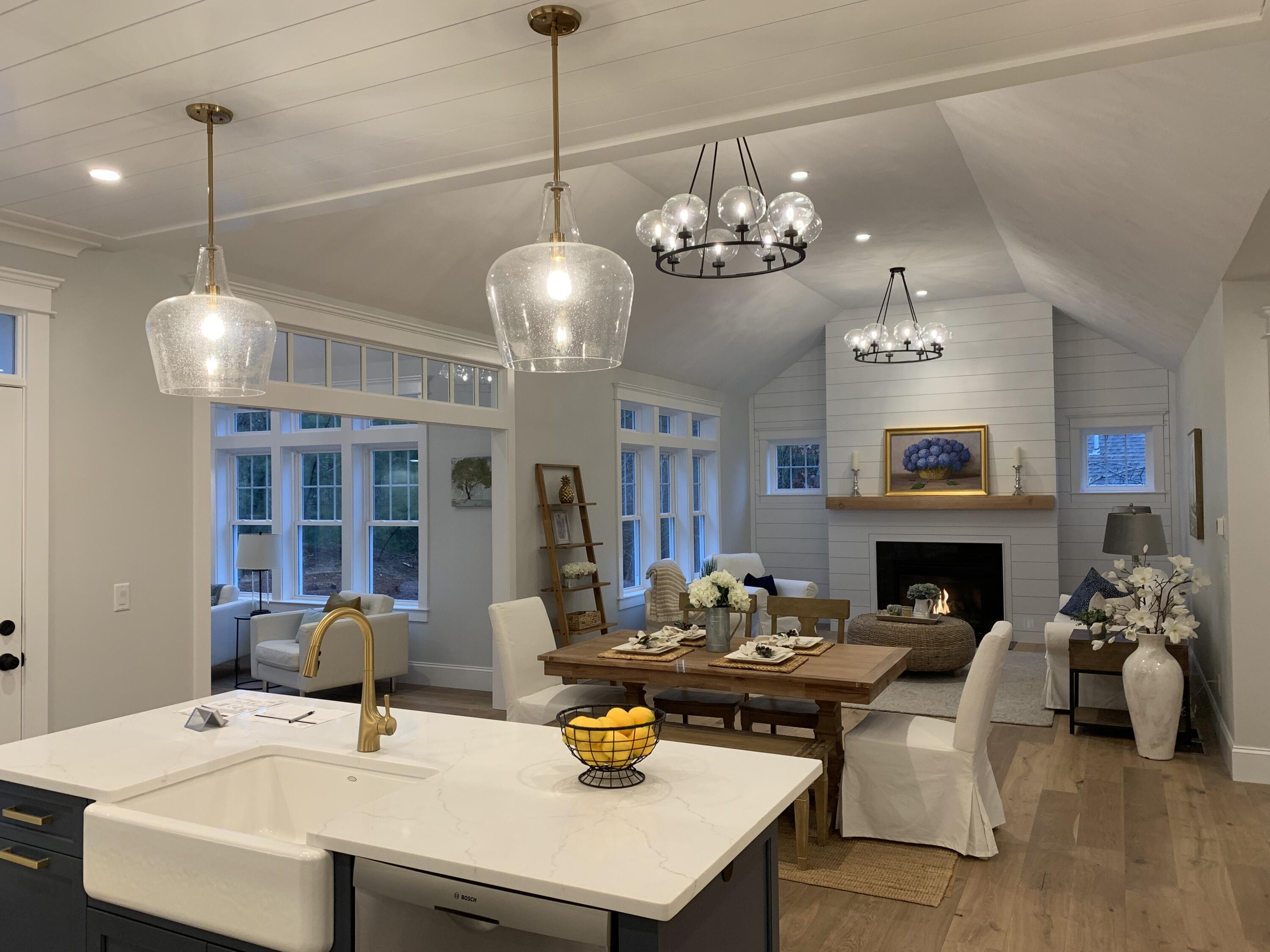 55 Palmer Road Mashpee, MA 02649 - Photo 4 of 42 a living room with fireplace furniture and a chandelier