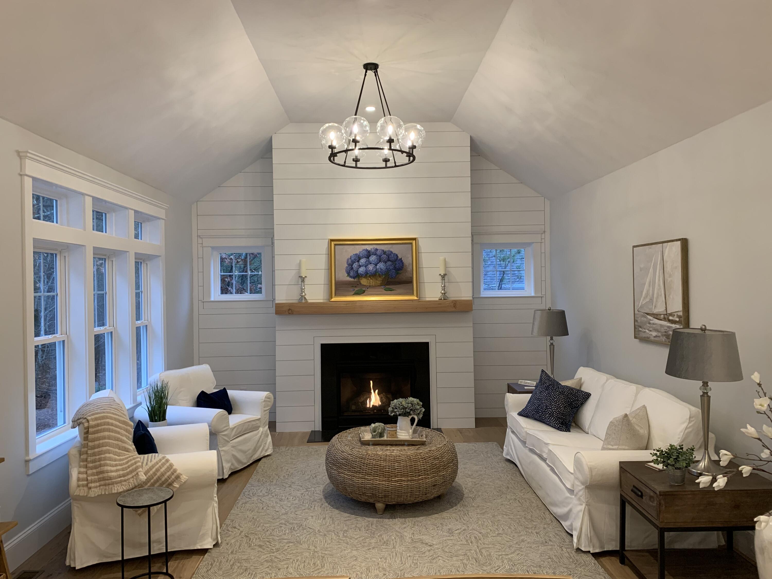 55 Palmer Road Mashpee, MA 02649 - Photo 5 of 42 a living room with furniture and a fireplace