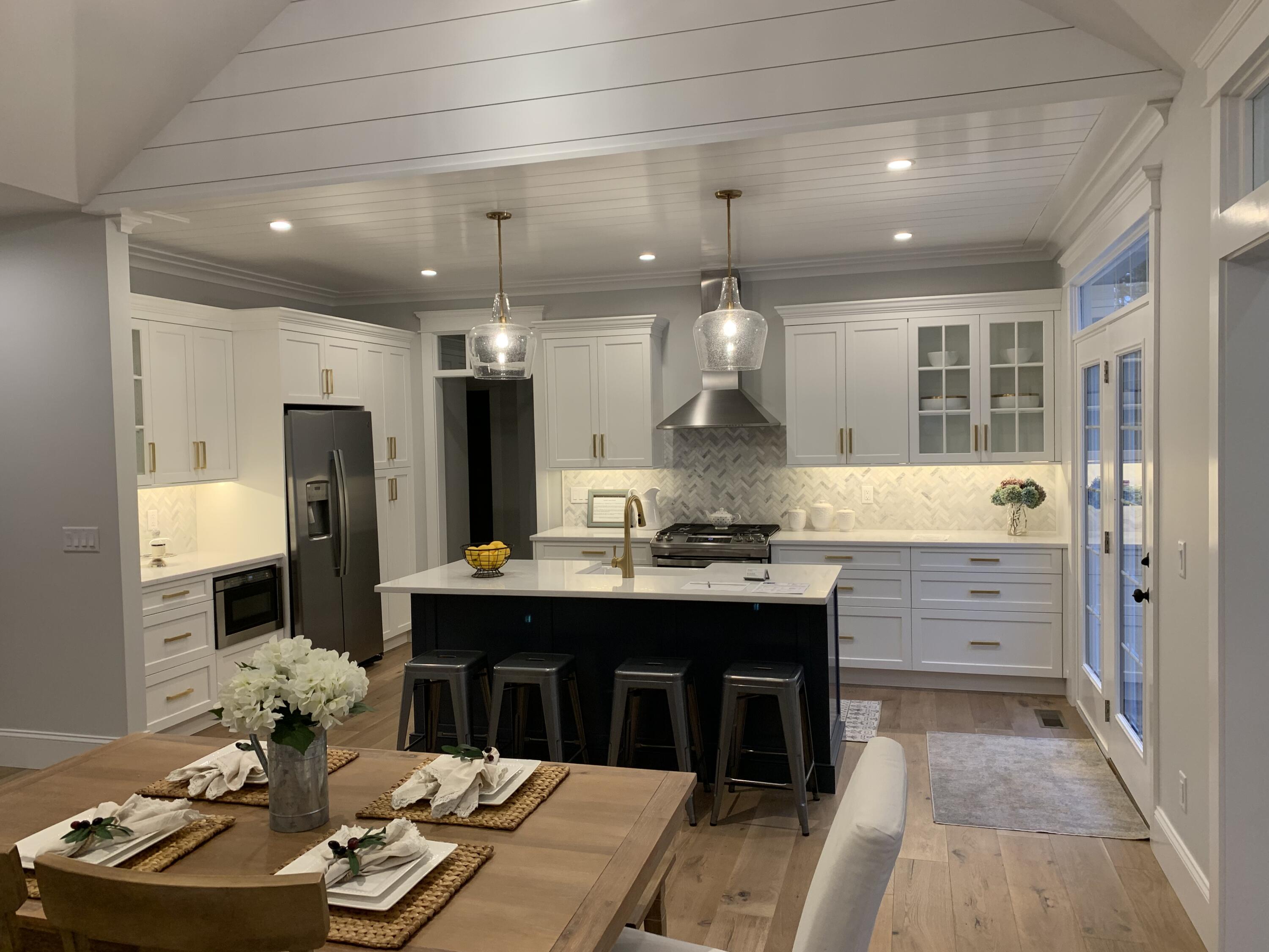 55 Palmer Road Mashpee, MA 02649 - Photo 7 of 42 a kitchen with kitchen island a sink stove and refrigerator