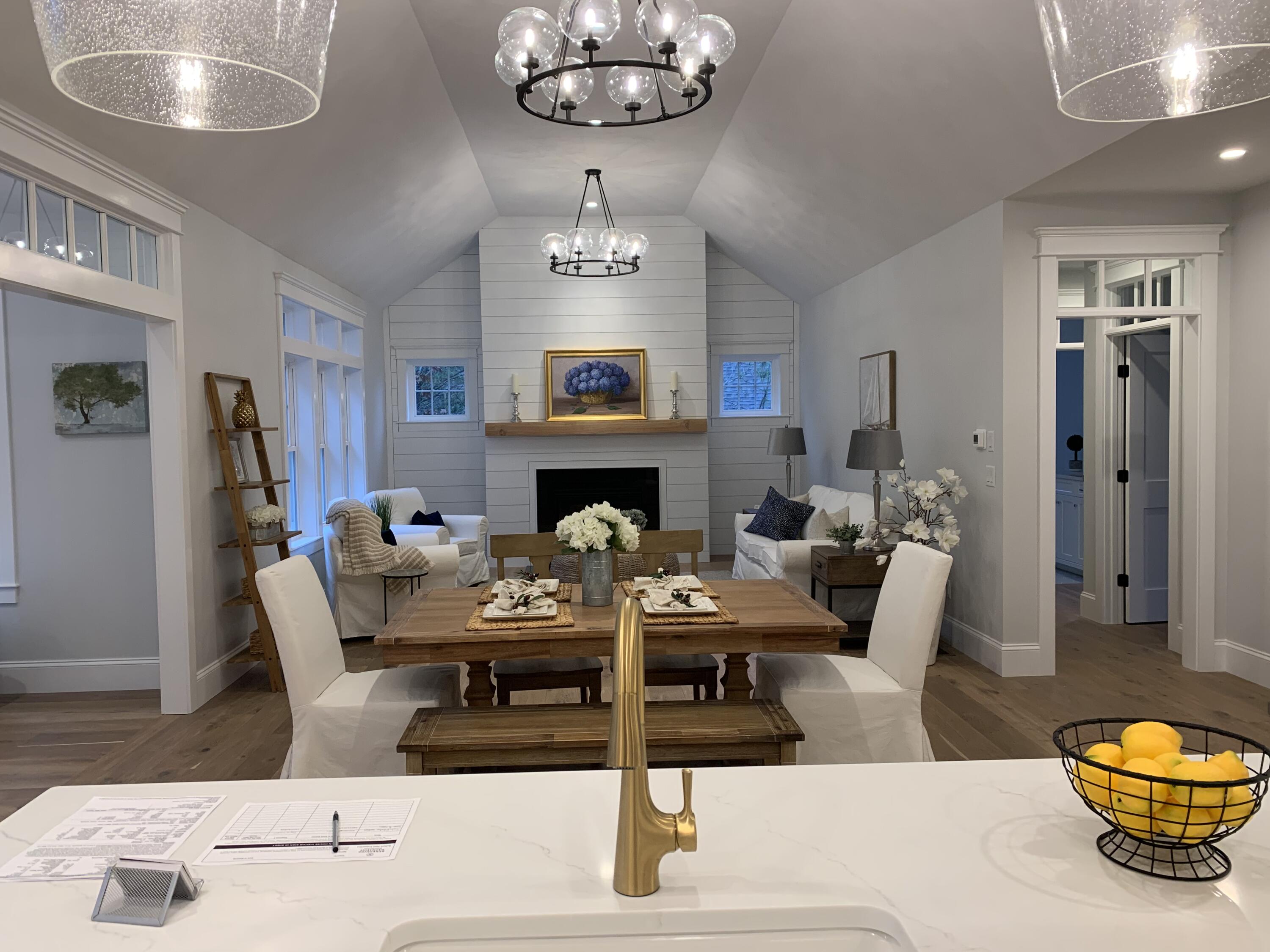 55 Palmer Road Mashpee, MA 02649 - Photo 8 of 42 a living room with furniture a table and kitchen view
