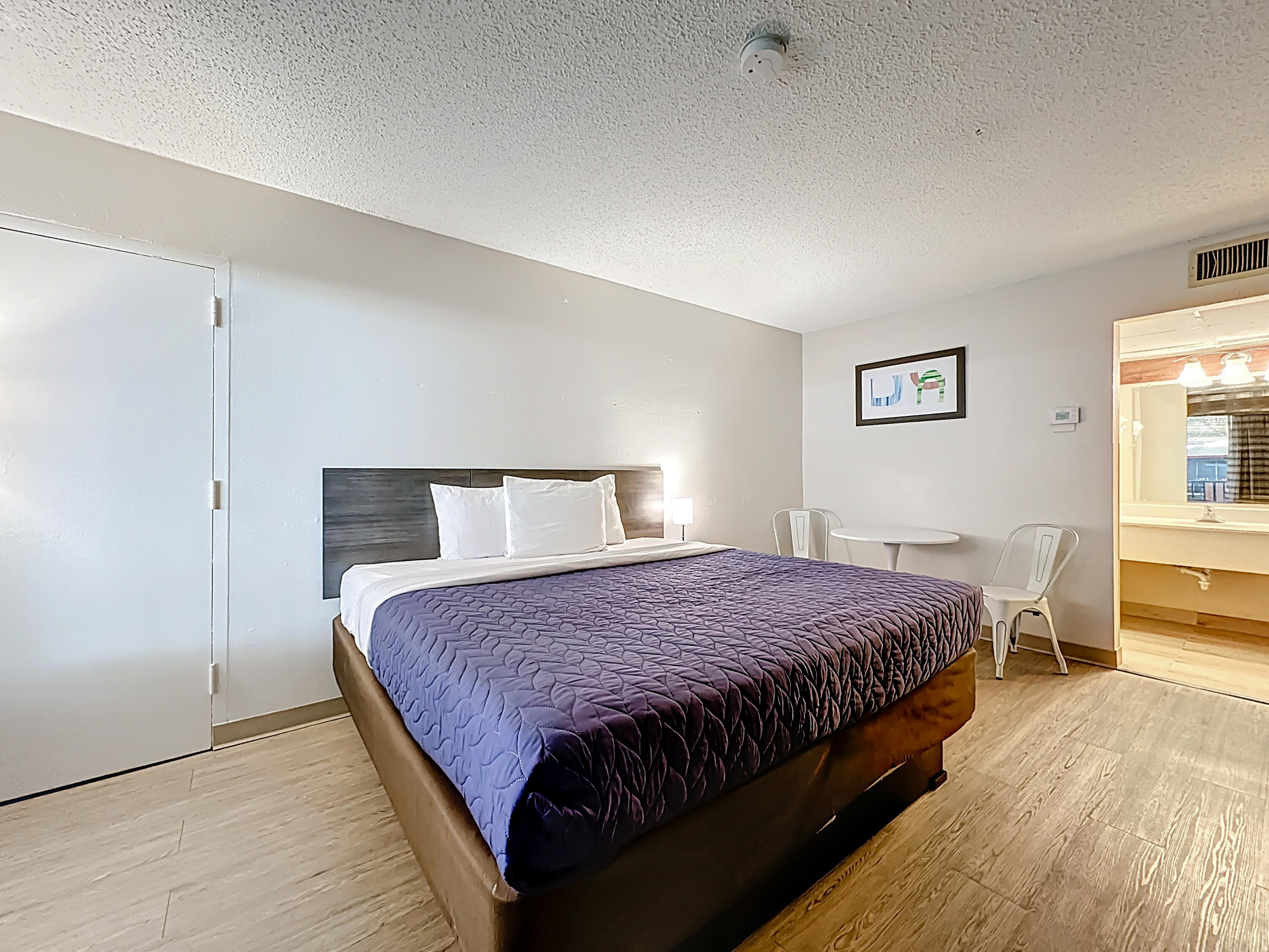 910 Suemac Road Jacksonville, FL 32254 - Photo 23 of 32 a bedroom with a bed and a night stand