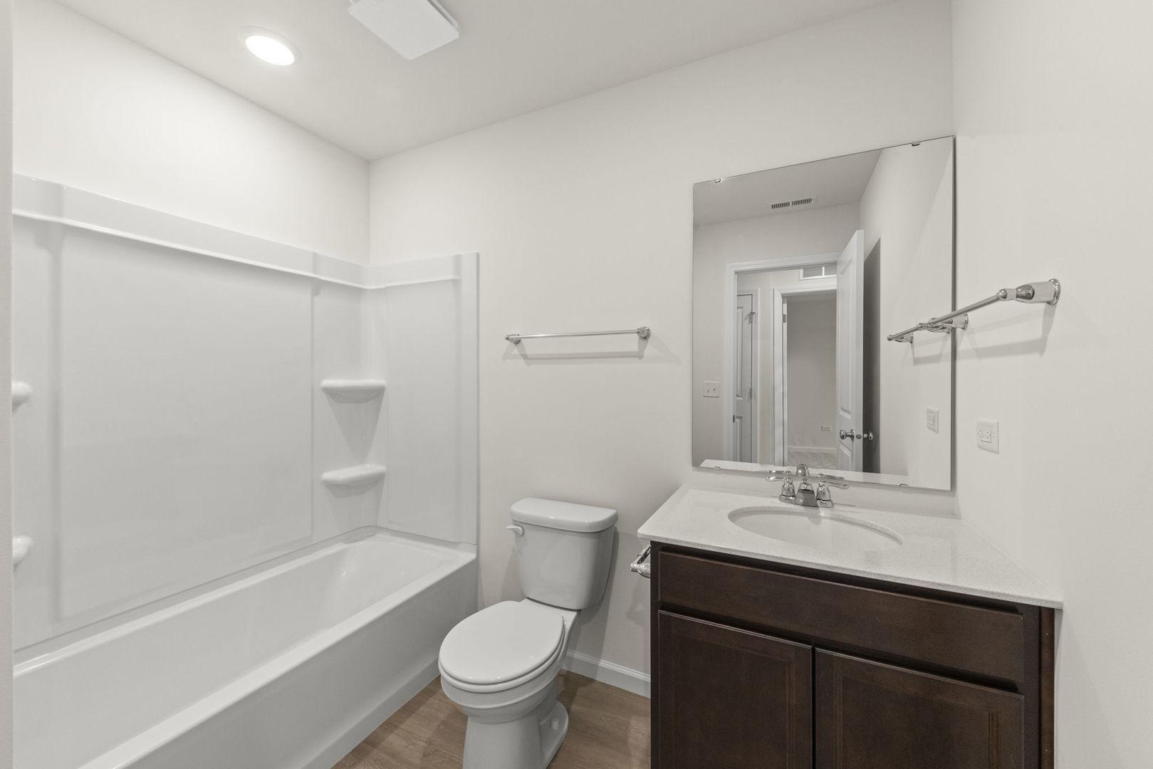 2416 Tailshot Road Plainfield, IL 60585 - Photo 19 of 27 a bathroom with a sink a toilet and a large mirror