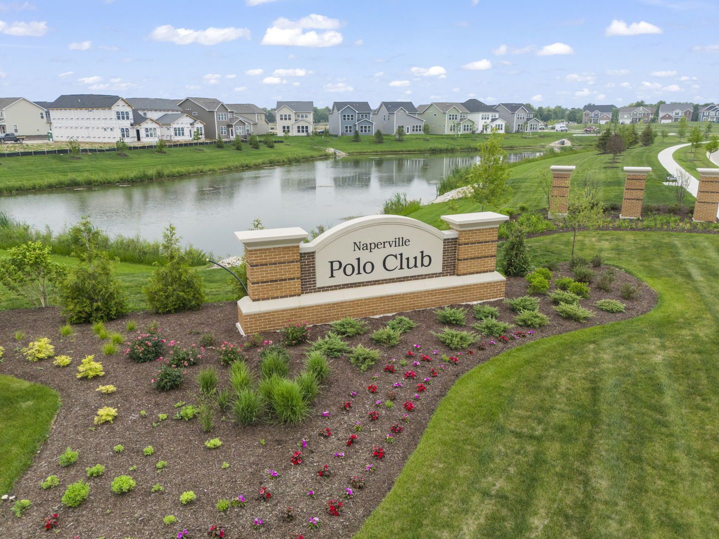 2416 Tailshot Road Plainfield, IL 60585 - Photo 23 of 27 a sign that is sitting in the middle of a lake