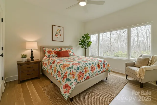 a bathroom with a granite countertop sink a large mirror and a vanity