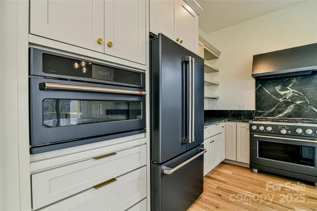 a kitchen with a sink stove and refrigerator