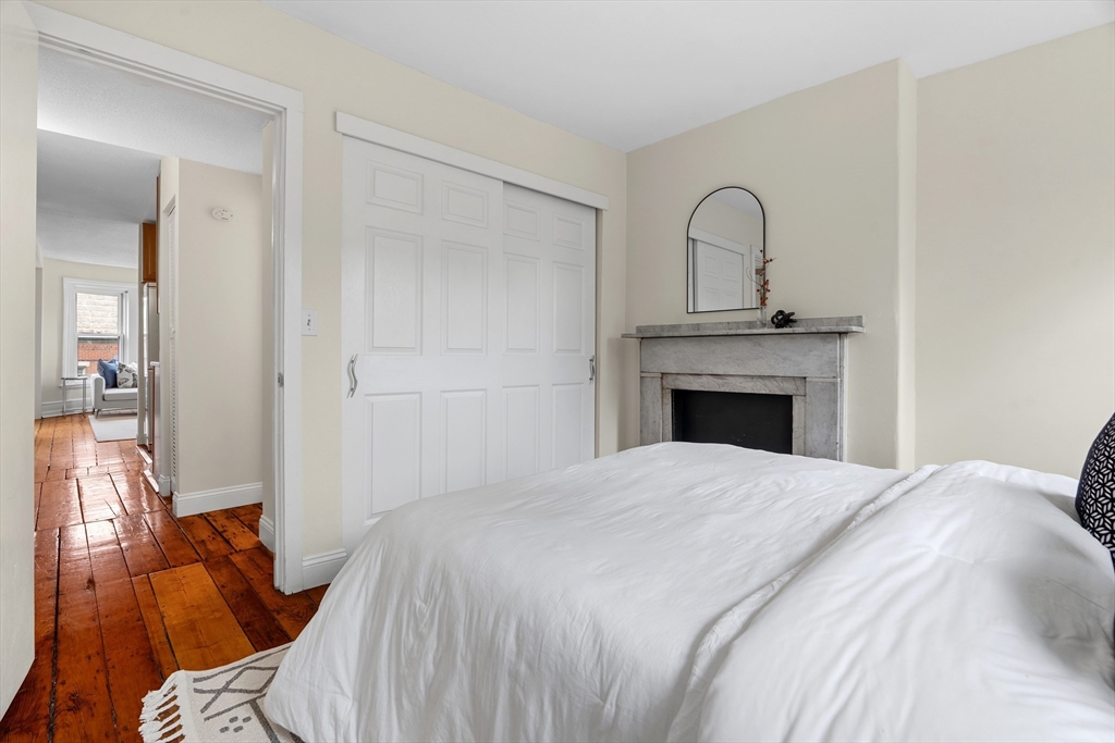 88 West Springfield Street, Unit 3 Boston, MA 02118 - Photo 12 of 17 a bedroom with a bed and a fireplace