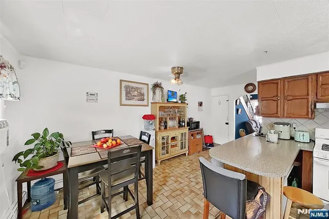 a large white kitchen with a large window