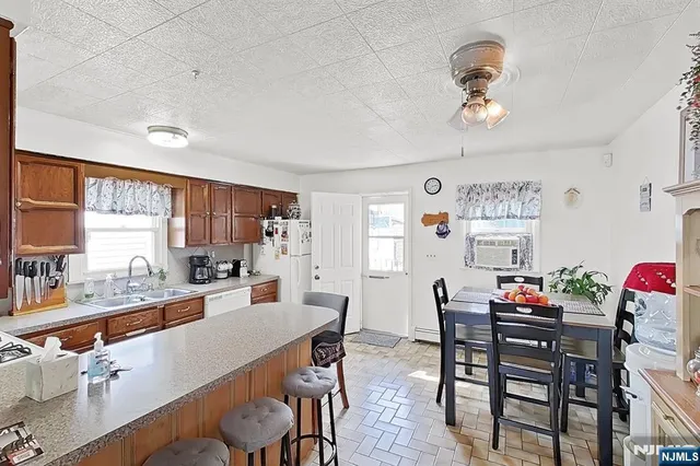 a room with furniture a rug and a window