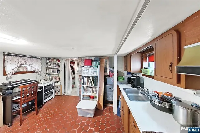 a view of a room with workspace and a window