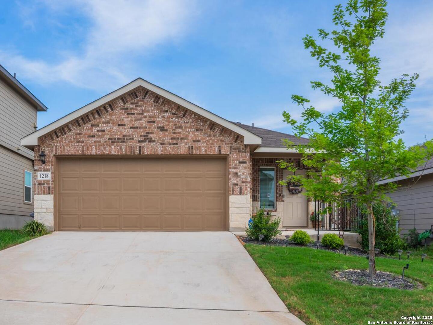 1218 Yellow Warbler Run San Antonio, TX 78253 - Photo 1 of 19 a front view of a house with a garden