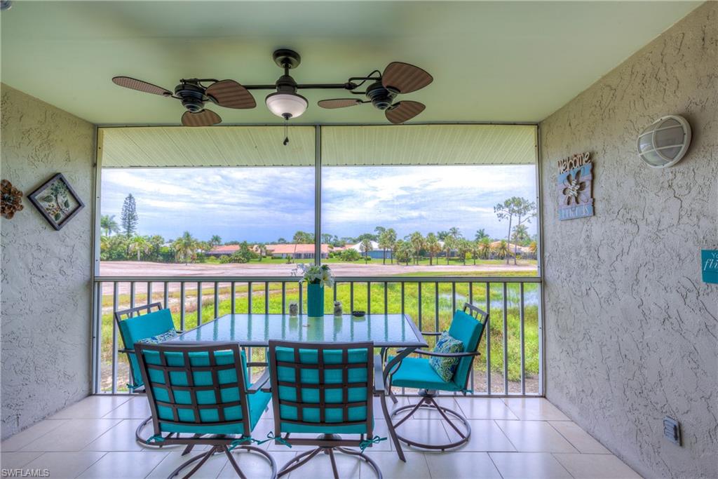 760 Augusta Boulevard, Unit D204 Naples, FL 34113 - Photo 16 of 32 a view of a chairs in balcony