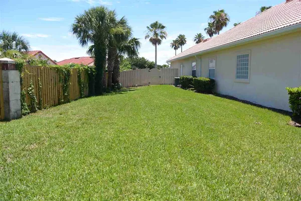 a view of a house with pool and sitting area
