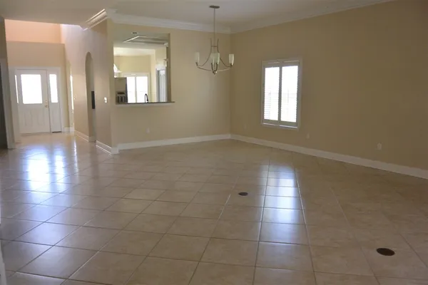 a view of an empty room with glass door