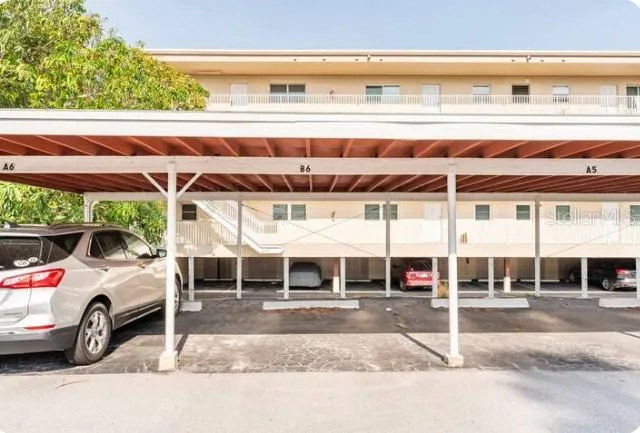a view of a car park in front of a building