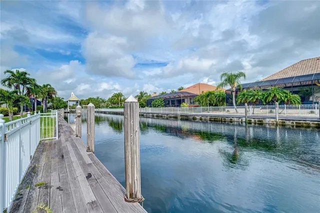 a lake view with a wooden bridge