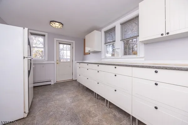 a view of cabinets and window