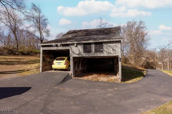 a front view of a house with yard and garage