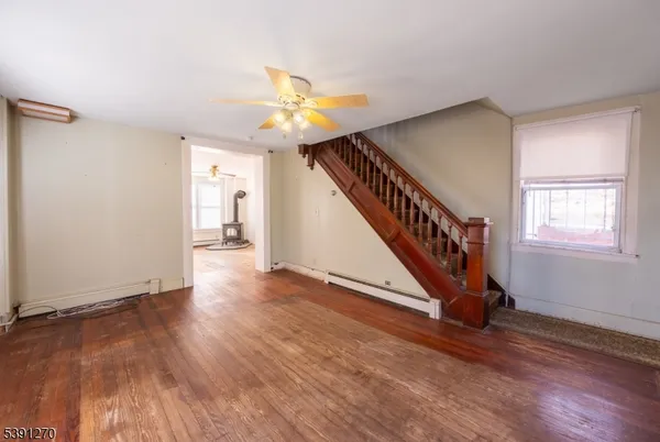 a view of an entryway with wooden floor