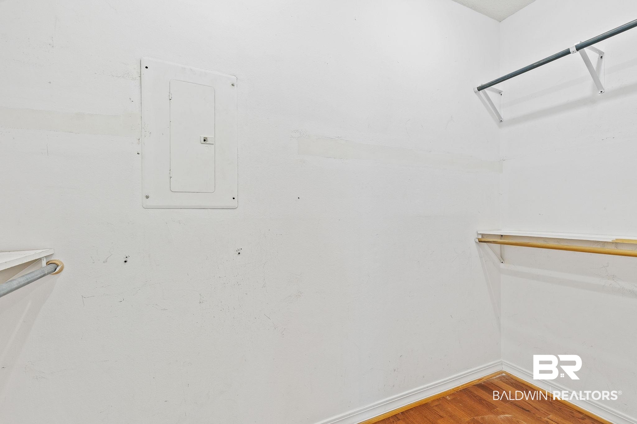 474 Ridgewood Drive Daphne, AL 36526 - Photo 30 of 57 Spacious closet featuring electric panel and wood-type flooring
