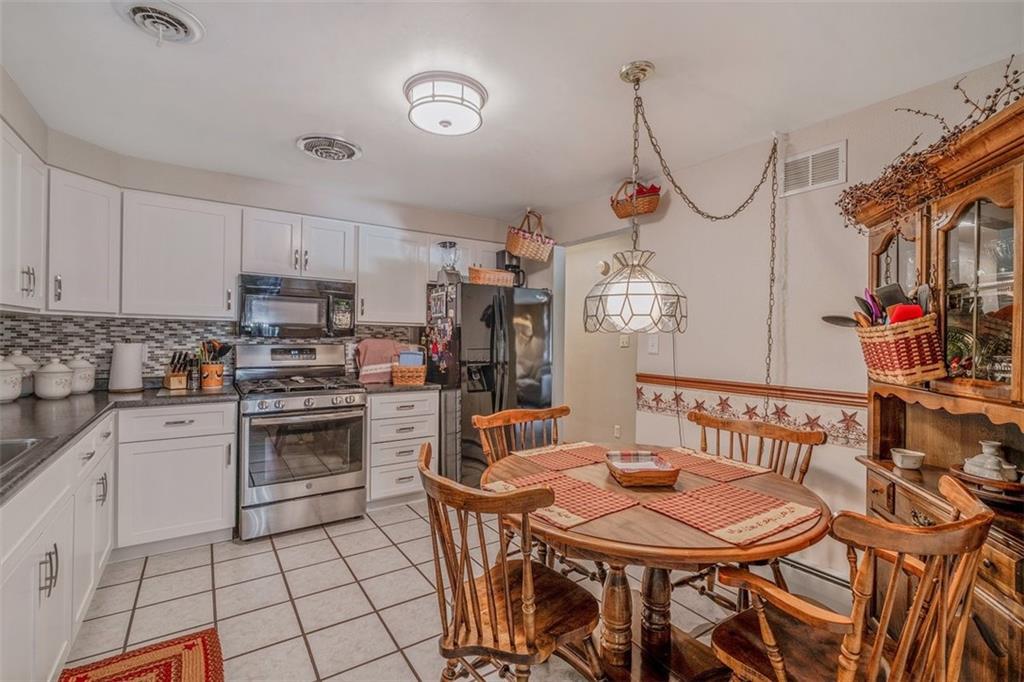 2668 Pangburn Hollow Road Monongahela, PA 15063 - Photo 14 of 44 a view of a kitchen area with furniture and wooden floor