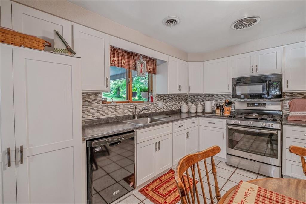 2668 Pangburn Hollow Road Monongahela, PA 15063 - Photo 16 of 44 a kitchen with stainless steel appliances a sink cabinets and a window