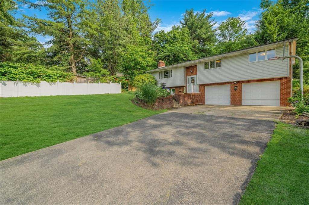 2668 Pangburn Hollow Road Monongahela, PA 15063 - Photo 17 of 44 a front view of a house with a garden and yard