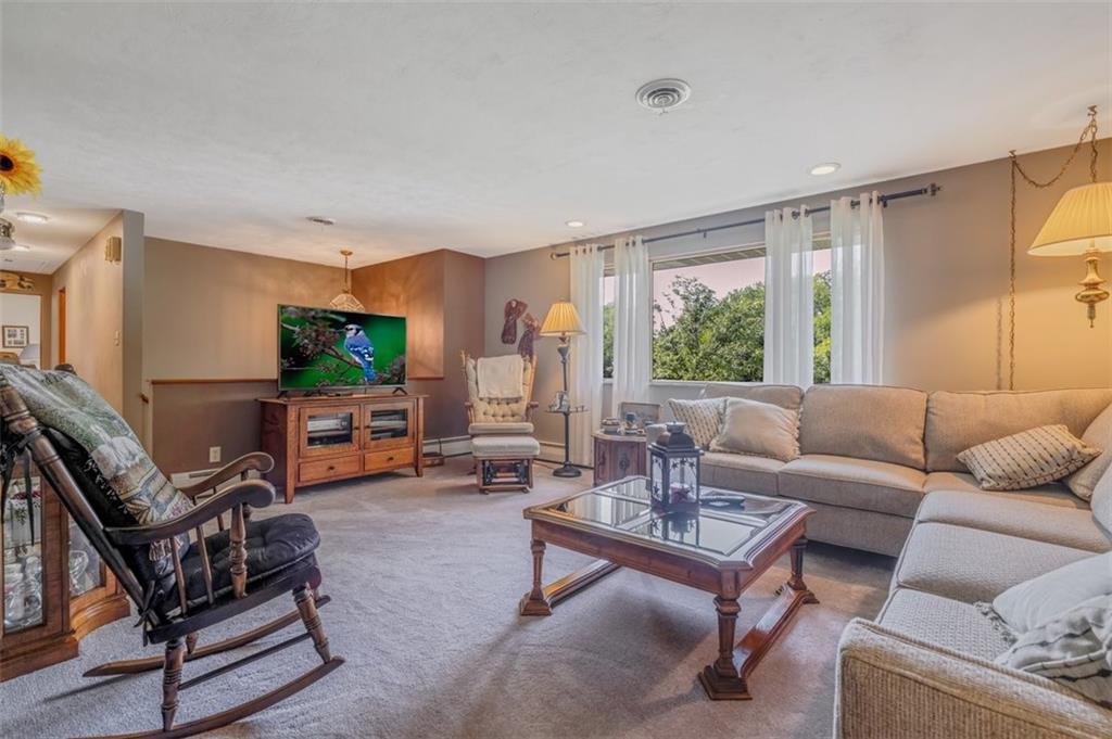 2668 Pangburn Hollow Road Monongahela, PA 15063 - Photo 2 of 44 a living room with furniture a flat screen tv and a large window