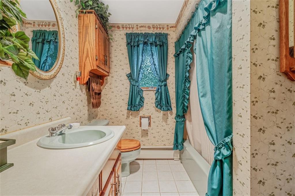 2668 Pangburn Hollow Road Monongahela, PA 15063 - Photo 27 of 44 a bathroom with a sink a mirror a bathtub and shower