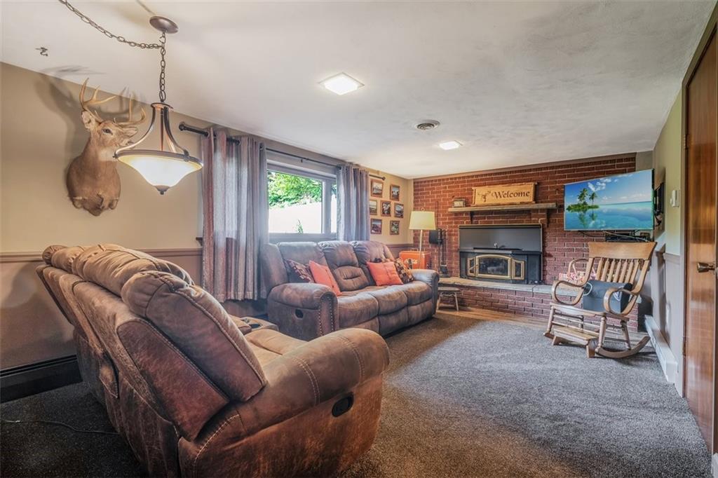 2668 Pangburn Hollow Road Monongahela, PA 15063 - Photo 33 of 44 a living room with furniture a window and a fireplace