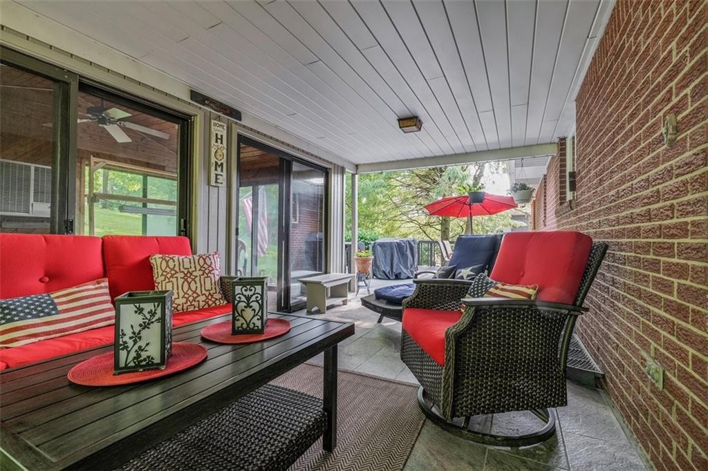 2668 Pangburn Hollow Road Monongahela, PA 15063 - Photo 42 of 44 a dining room with furniture a potted plant and a floor to ceiling window