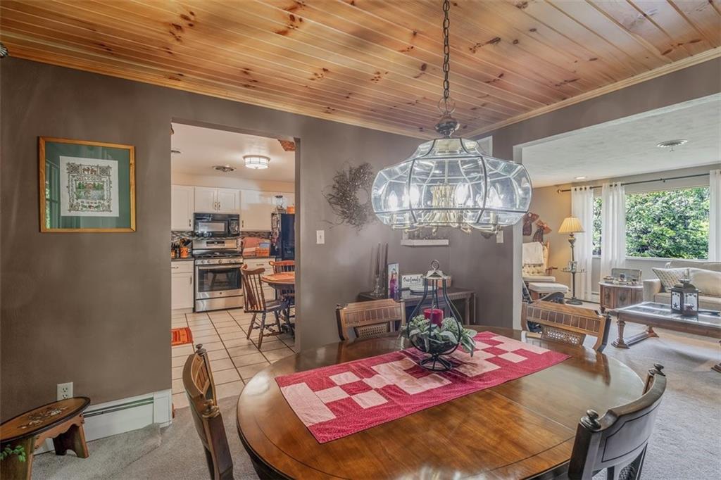 2668 Pangburn Hollow Road Monongahela, PA 15063 - Photo 6 of 44 a view of a dining room with furniture a chandelier and large window