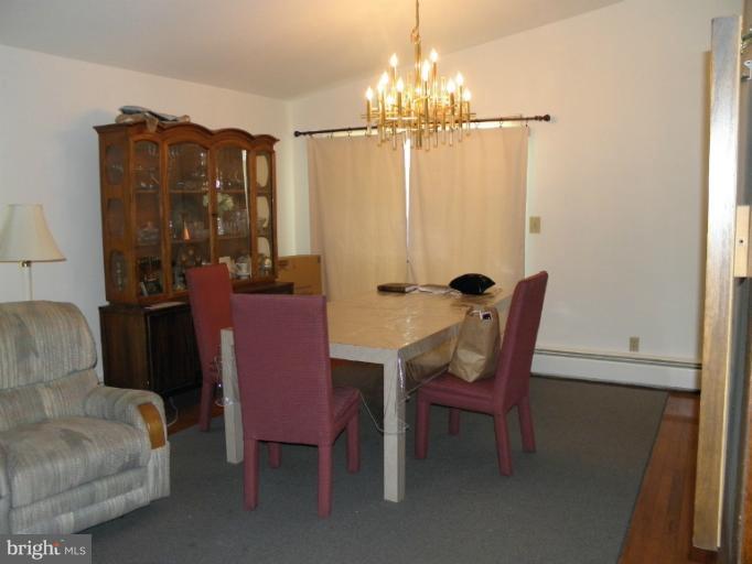 2323 Micarol Road Baltimore, MD 21209 - Photo 2 of 6 a view of a dining room with furniture and chandelier