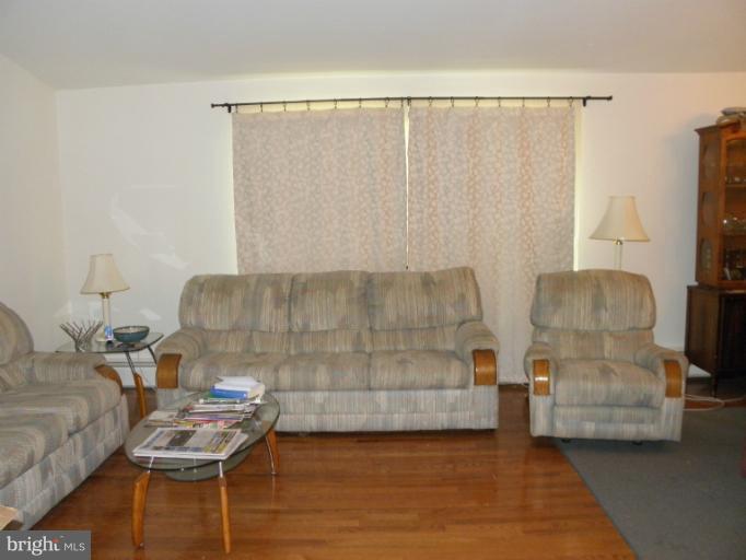 2323 Micarol Road Baltimore, MD 21209 - Photo 4 of 6 a living room with furniture and a couch