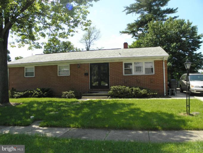 2323 Micarol Road Baltimore, MD 21209 - Photo 6 of 6 a front view of a house with a yard