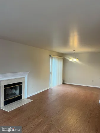 an empty room with a fireplace