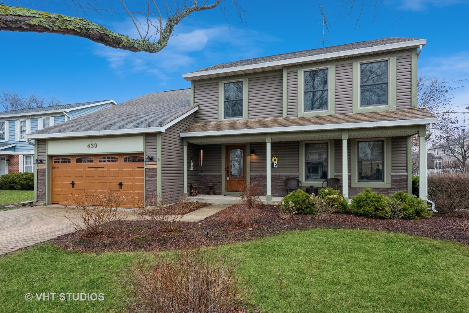 front view of a house with a yard
