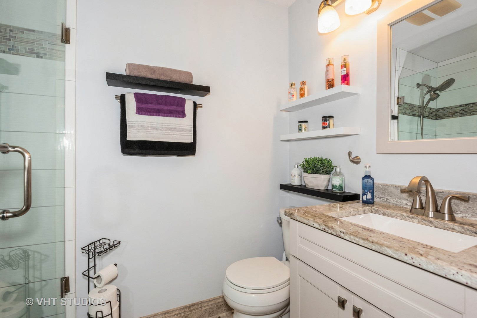 Undisclosed Address Carol Stream, IL 60188 - Photo 16 of 17 a bathroom with a granite countertop sink a toilet and a mirror