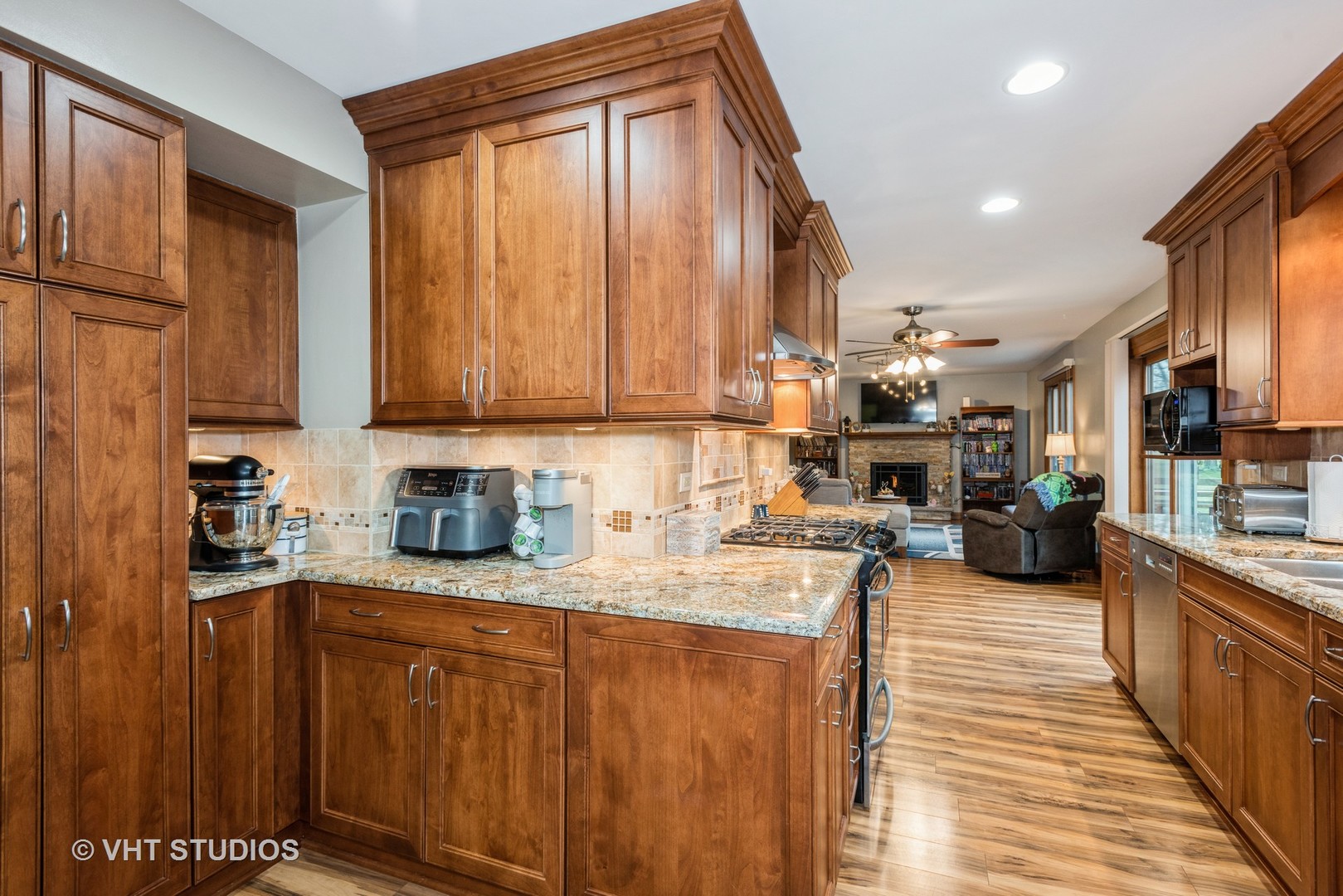 Undisclosed Address Carol Stream, IL 60188 - Photo 7 of 17 a kitchen with stainless steel appliances granite countertop a stove a sink dishwasher and a refrigerator with wooden cabinets
