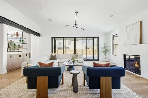 a living room with furniture and fireplace