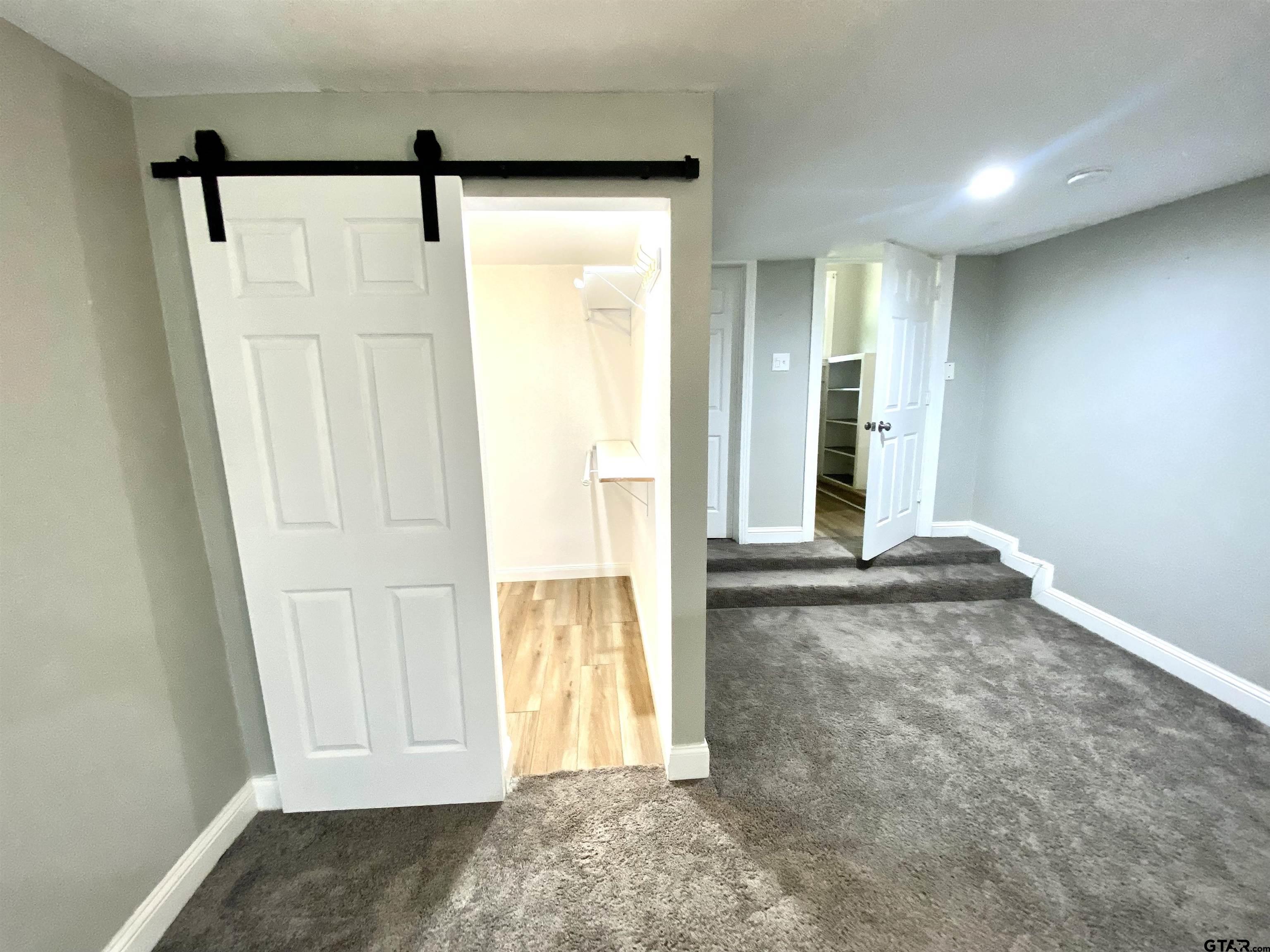 1914 Parklen Street Tyler, TX 75701 - Photo 16 of 39 a view of front door with wooden floor