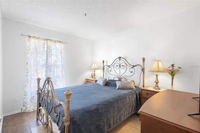 a bedroom with two beds and a table