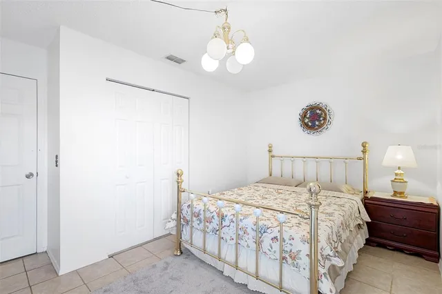 a bedroom with a bed and a table