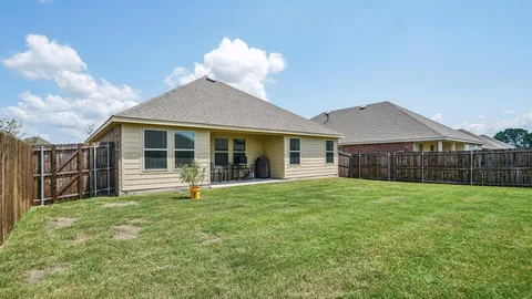 a view of house with outdoor seating space