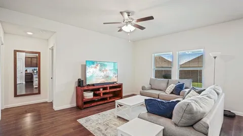 a living room with furniture and windows