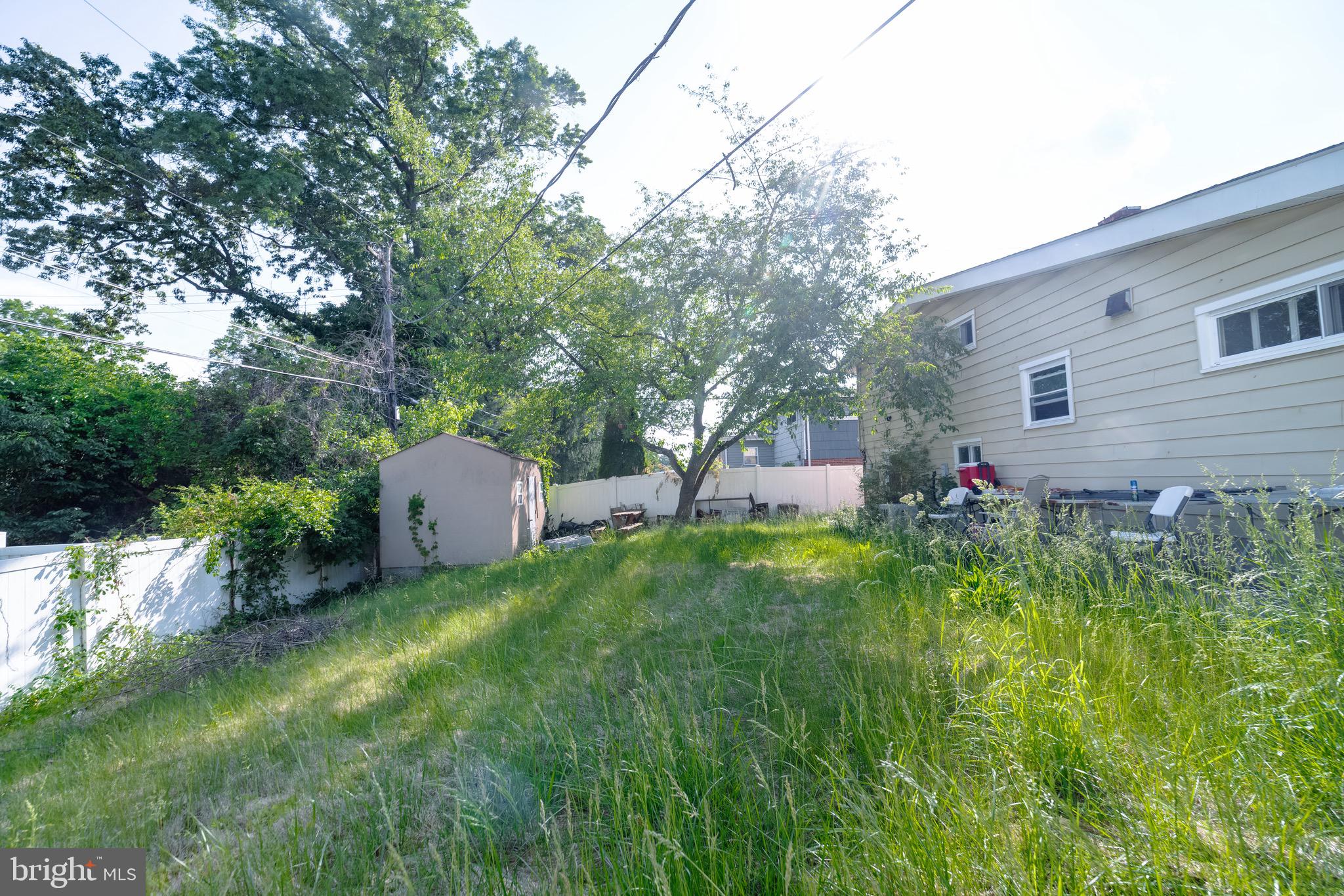 4125 Ronis Road Pikesville, MD 21208 - Photo 37 of 40 a front view of a house with a yard and trees