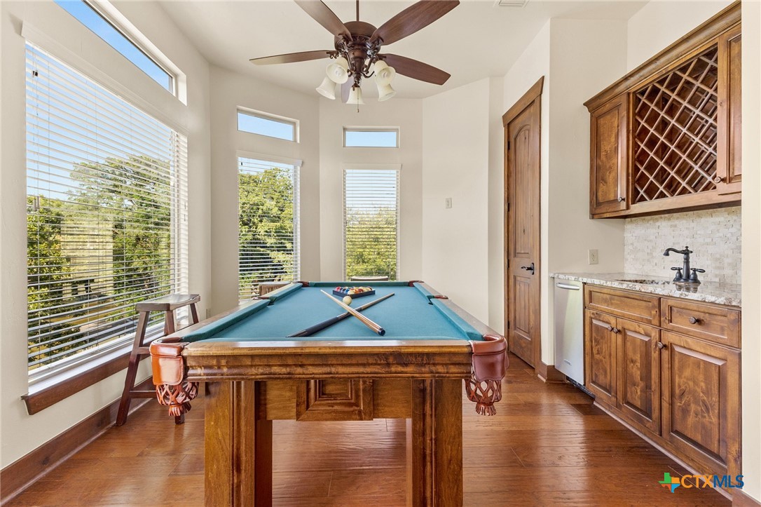 134 Bandit Beach Road New Braunfels, TX 78130 - Photo 12 of 46 a room with chandelier fan and windows