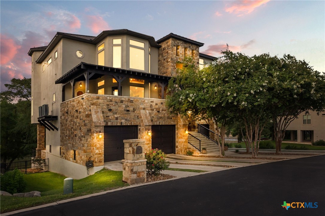 134 Bandit Beach Road New Braunfels, TX 78130 - Photo 2 of 46 a front view of a house with a garden