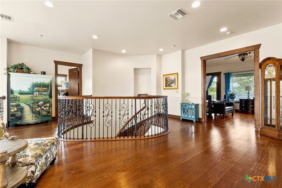 134 Bandit Beach Road New Braunfels, TX 78130 - Photo 23 of 46 a floor to ceiling window and wooden floor